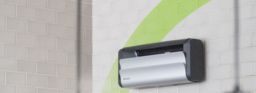 A sleek, wall-mounted Rentokil Lumnia LED fly control unit installed on a white tiled wall. This energy-efficient insect light trap uses UV LED technology to capture flies hygienically in commercial environments.