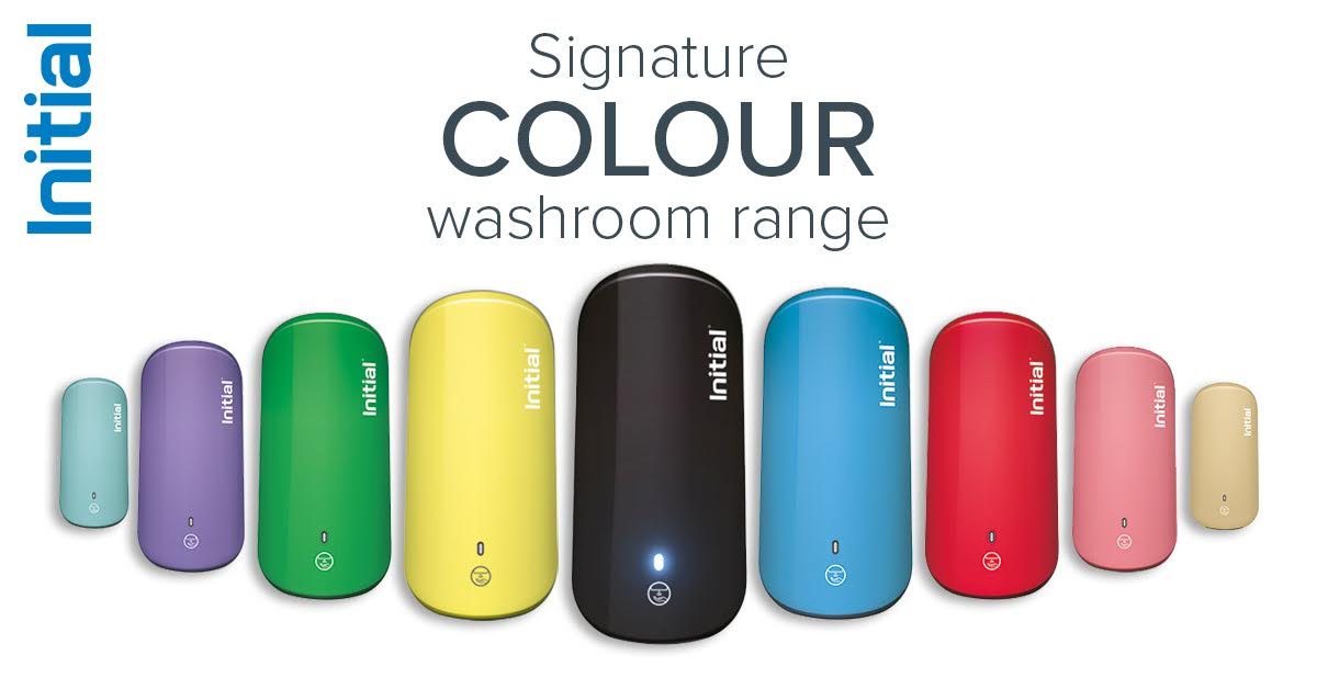 A full lineup of colorful Initial Signature washroom hygiene dispensers displayed against a white background.
